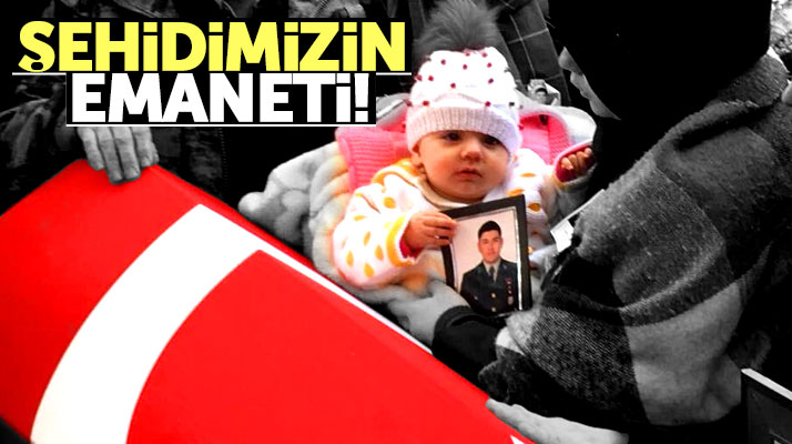 Afrin şehidi Göksu Şafak Şahin'in 7 aylık kızı Öykü, babasının fotoğrafını sımsıkı tuttu
