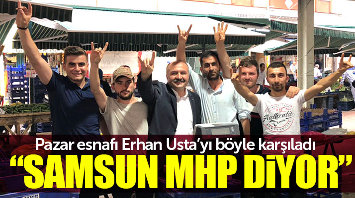 Erhan Usta'yı Samsun'da pazar esnafları bozkurt işareti yaparak karşıladı
