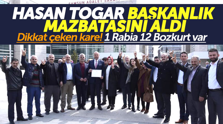 Hasan Togar mazbatasını alırken bir kişi Rabia, 12 kişi ise Bozkurt selamı verdi