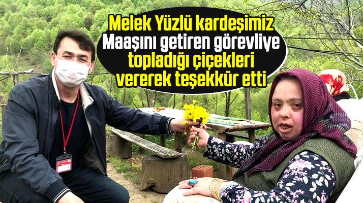 Samsun'da down sendromlu maaşını getiren görevliye çiçek vererek teşekkür etti
